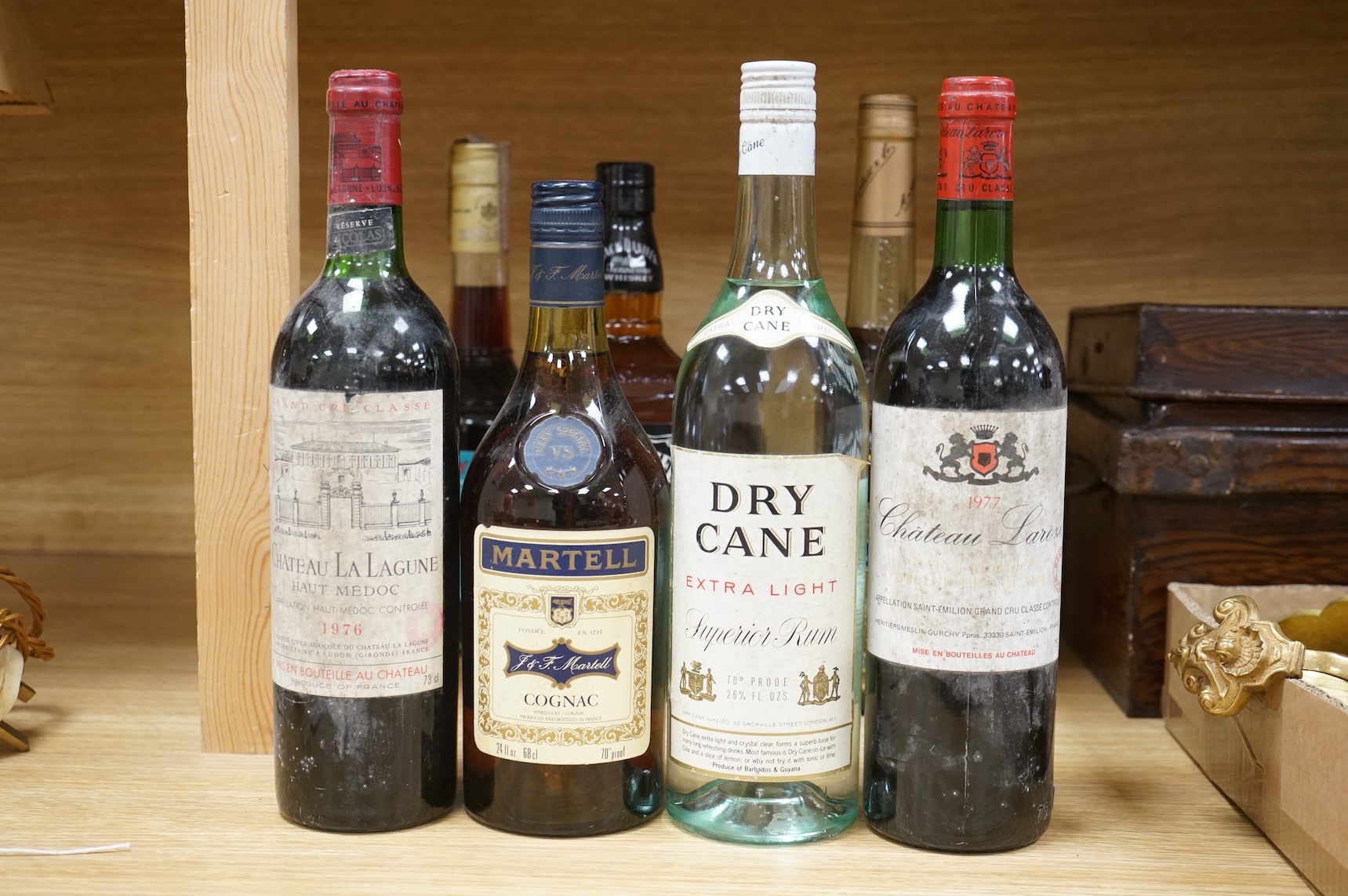 Two bottles of claret and five bottles of spirits to include Dry Cane Rum and Martel Cognac